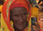 Woman in traditional dress holding a mobile phone