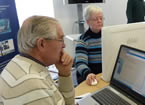 photo of elderly people using computers
