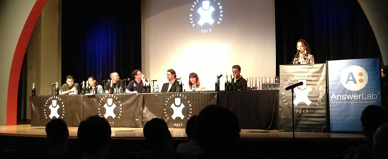 Judges at a table on stage