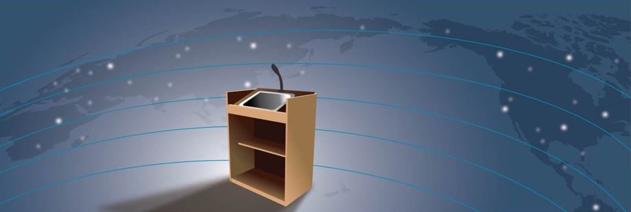 A lectern with a computer stands in a network that covers the globe