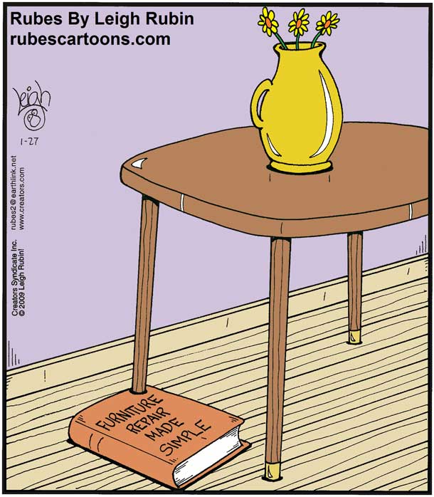 A book titled furniture repair made simple is placed under a table leg, making the table stand level.