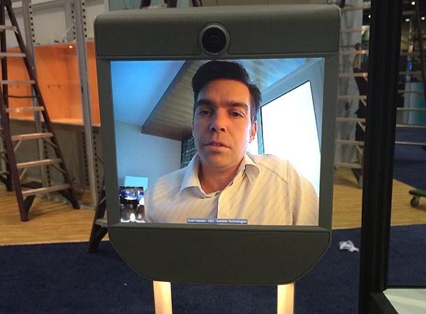 [:en]Large monitor on wheels that allows for video chat. Makes those in the room feel like the person is physically there.[:]