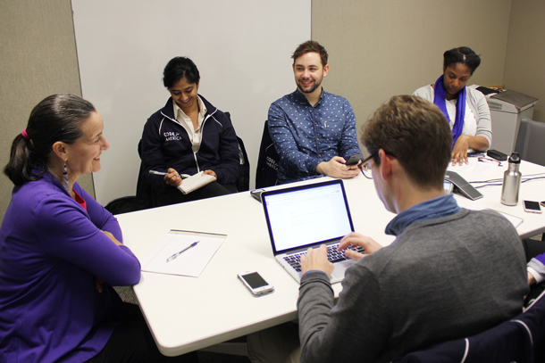 Photograph of a group interviewing a participant